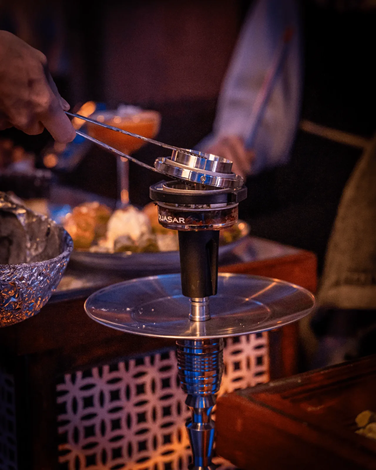 Home 11 Shisha being prepared at Mazazik hookah lounge in Amsterdam